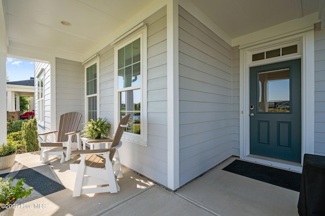 property entrance with covered porch