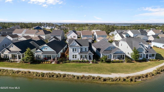 aerial perspective of suburban area featuring a large body of water