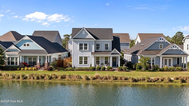view of front of home with a water view, a porch, and a residential view