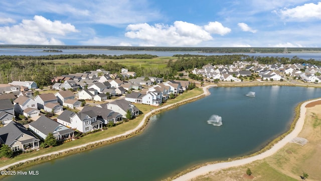aerial perspective of suburban area with a large body of water