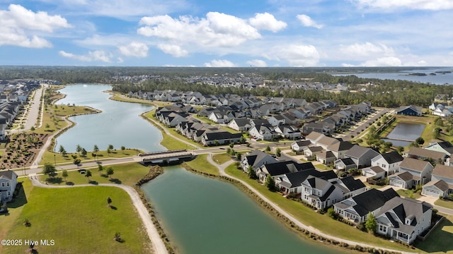 aerial overview of property's location featuring a large body of water and nearby suburban area