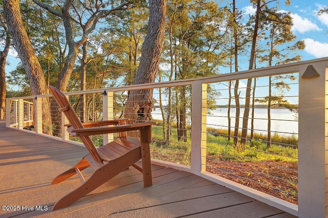 wooden terrace with a water view