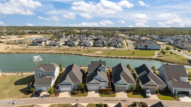 aerial view of residential area with a large body of water