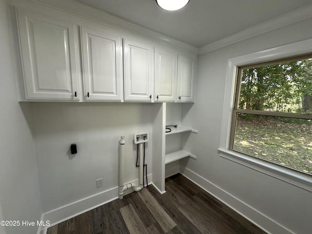 205 Mulberry St, Winton, NC 27986 - laundry area with hookup for an electric dryer, dark wood finished floors, baseboards, cabinet space, and crown molding