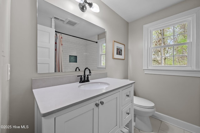 bathroom with visible vents, baseboards, tile patterned floors, and toilet