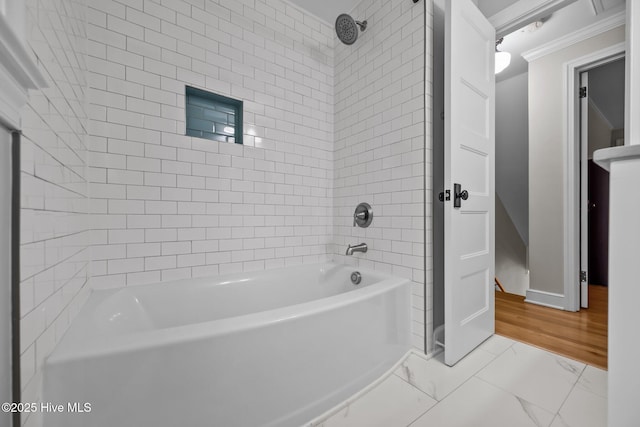 full bathroom featuring baseboards, ornamental molding, bathtub / shower combination, and marble finish floor