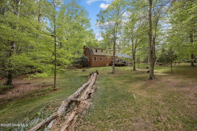 view of yard with a wooden deck