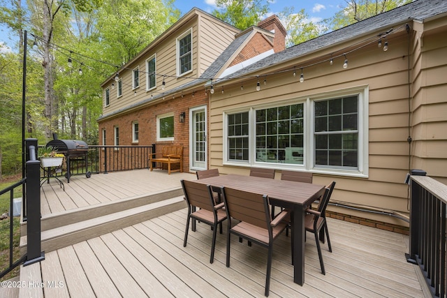 deck featuring outdoor dining area