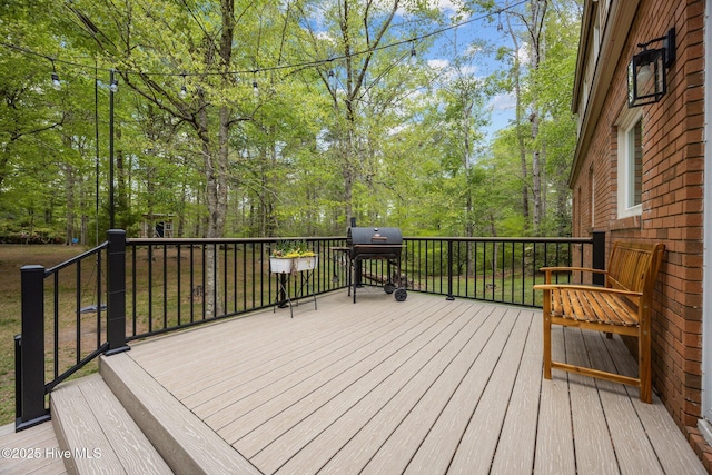 wooden terrace featuring area for grilling