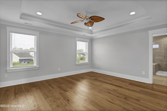 4434 Old Towne St, Wilmington, NC 28412 - unfurnished room featuring a raised ceiling, ceiling fan, hardwood / wood-style flooring, recessed lighting, and baseboards