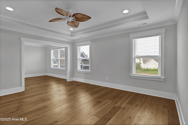 4434 Old Towne St, Wilmington, NC 28412 - unfurnished room with a tray ceiling, baseboards, hardwood / wood-style flooring, ceiling fan, and recessed lighting
