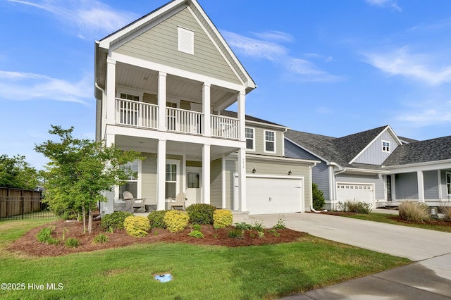 4434 Old Towne St, Wilmington, NC 28412 - greek revival inspired property featuring a balcony, a porch, concrete driveway, and a garage