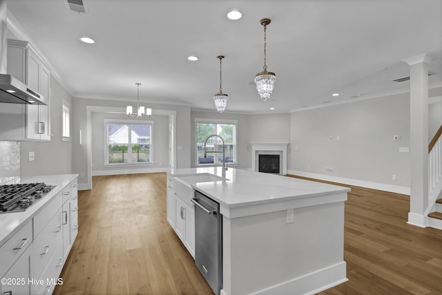 4434 Old Towne St, Wilmington, NC 28412 - kitchen with a sink, appliances with stainless steel finishes, open floor plan, crown molding, and baseboards