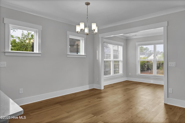 4434 Old Towne St, Wilmington, NC 28412 - unfurnished dining area featuring plenty of natural light, baseboards, a chandelier, and crown molding