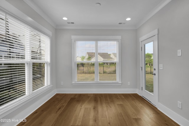 4434 Old Towne St, Wilmington, NC 28412 - unfurnished room featuring wood finished floors, baseboards, and crown molding