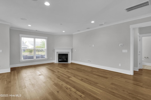 4434 Old Towne St, Wilmington, NC 28412 - unfurnished living room with crown molding, hardwood / wood-style floors, a high end fireplace, baseboards, and recessed lighting