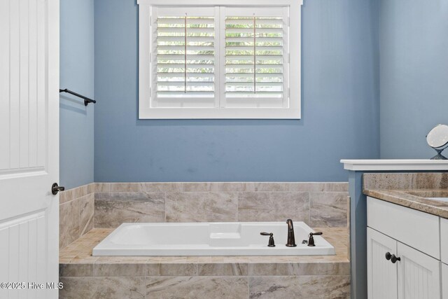 6460 Carrick Bend Trl SW, Ocean Isle Beach, NC 28469 - full bath with a garden tub and vanity
