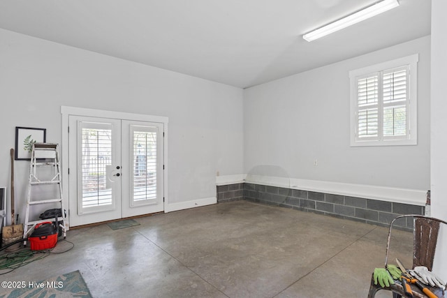 6460 Carrick Bend Trl SW, Ocean Isle Beach, NC 28469 - empty room featuring finished concrete floors and french doors