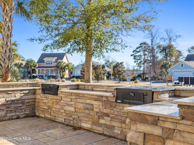6460 Carrick Bend Trl SW, Ocean Isle Beach, NC 28469 - view of patio / terrace featuring exterior kitchen