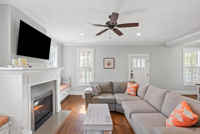6460 Carrick Bend Trl SW, Ocean Isle Beach, NC 28469 - living area featuring a fireplace, dark wood-style floors, a ceiling fan, crown molding, and recessed lighting