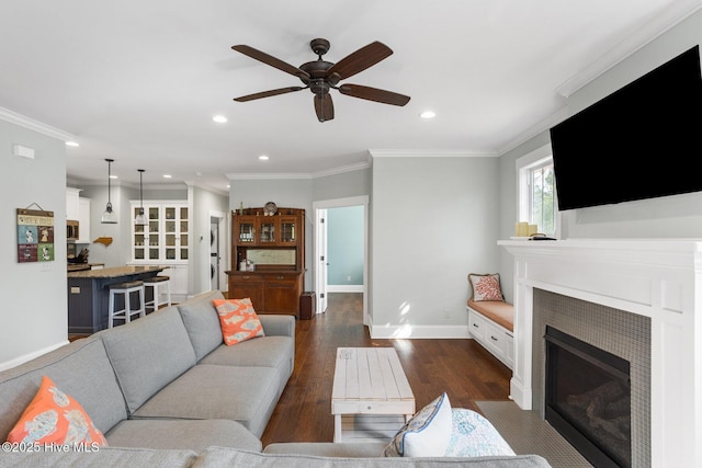 6460 Carrick Bend Trl SW, Ocean Isle Beach, NC 28469 - living room featuring a ceiling fan, recessed lighting, dark wood-style flooring, a fireplace, and ornamental molding