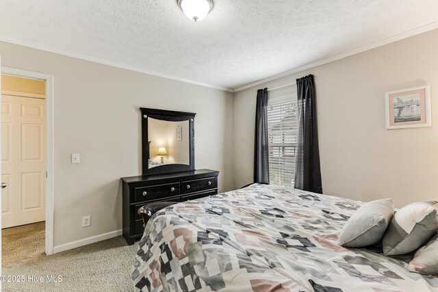 bedroom featuring baseboards, light carpet, a textured ceiling, and crown molding