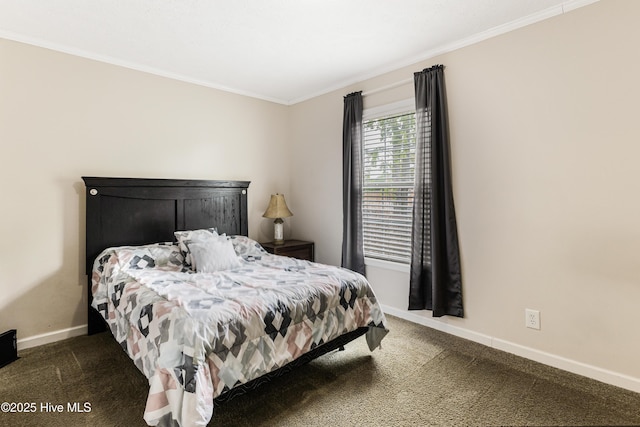 carpeted bedroom featuring crown molding and baseboards