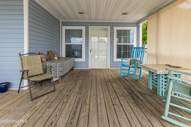 wooden terrace featuring a porch