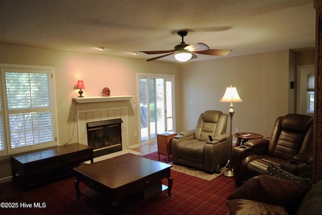 10 Flint Ct Unit 12, Pinehurst, NC 28374 - living area with a ceiling fan, a tiled fireplace, and baseboards