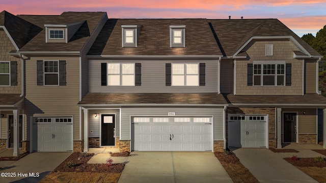 806 Pryor St Unit 50, Mebane, NC 27302 - townhome / multi-family property with an attached garage, driveway, and stone siding