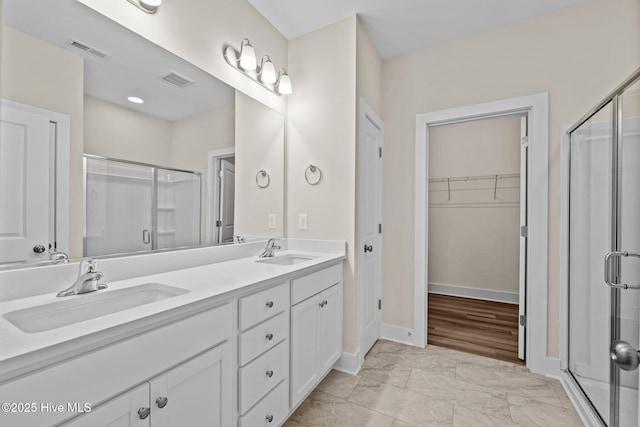 806 Pryor St Unit 50, Mebane, NC 27302 - full bathroom featuring visible vents, a sink, marble finish floor, and a stall shower