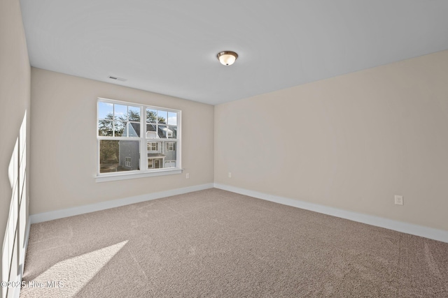 806 Pryor St Unit 50, Mebane, NC 27302 - carpeted spare room with baseboards