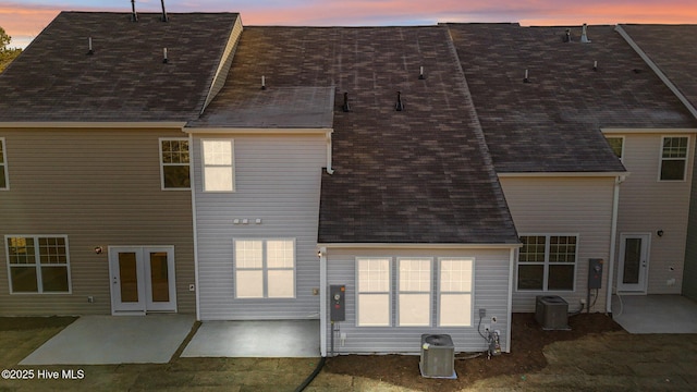 806 Pryor St Unit 50, Mebane, NC 27302 - rear view of house featuring a patio area, roof with shingles, and central AC