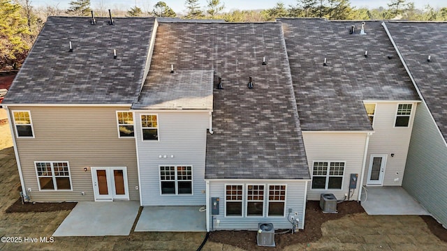 806 Pryor St Unit 50, Mebane, NC 27302 - back of property featuring central AC unit, a patio area, and a shingled roof