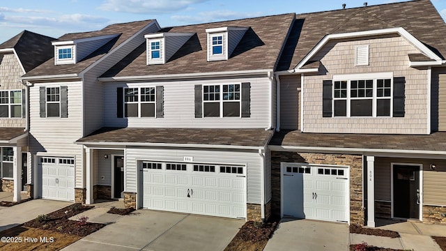 806 Pryor St Unit 50, Mebane, NC 27302 - townhome / multi-family property featuring roof with shingles, driveway, stone siding, and a garage