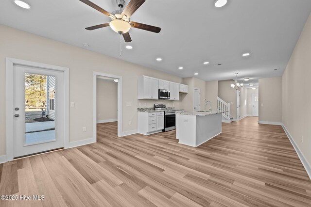 806 Pryor St Unit 50, Mebane, NC 27302 - kitchen with ceiling fan with notable chandelier, stainless steel appliances, white cabinets, baseboards, and recessed lighting