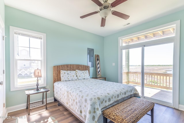 210 Gysgt Dw Boatman Dr Unit 1, North Topsail Beach, NC 28460 - bedroom featuring access to exterior, multiple windows, and dark wood-style flooring