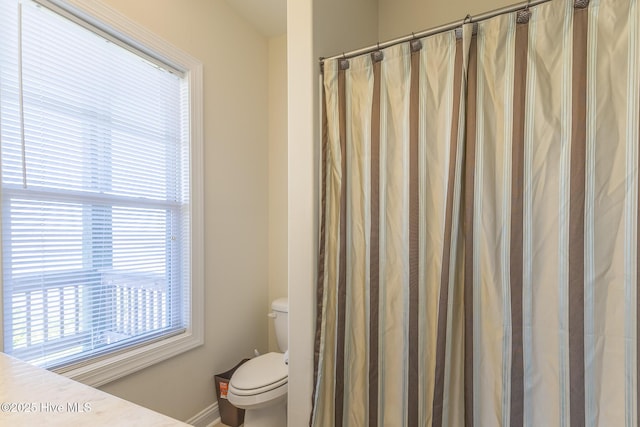 210 Gysgt Dw Boatman Dr Unit 1, North Topsail Beach, NC 28460 - full bathroom with toilet, plenty of natural light, baseboards, and a shower with curtain