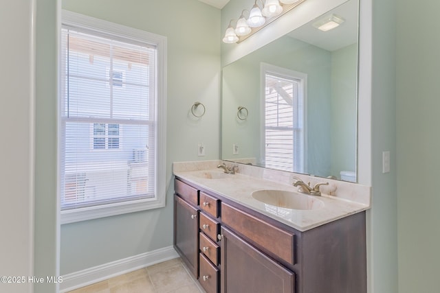 210 Gysgt Dw Boatman Dr Unit 1, North Topsail Beach, NC 28460 - full bath with double vanity, tile patterned flooring, baseboards, and toilet