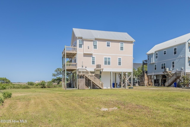 210 Gysgt Dw Boatman Dr Unit 1, North Topsail Beach, NC 28460 - rear view of property with stairs, a yard, metal roof, and a deck