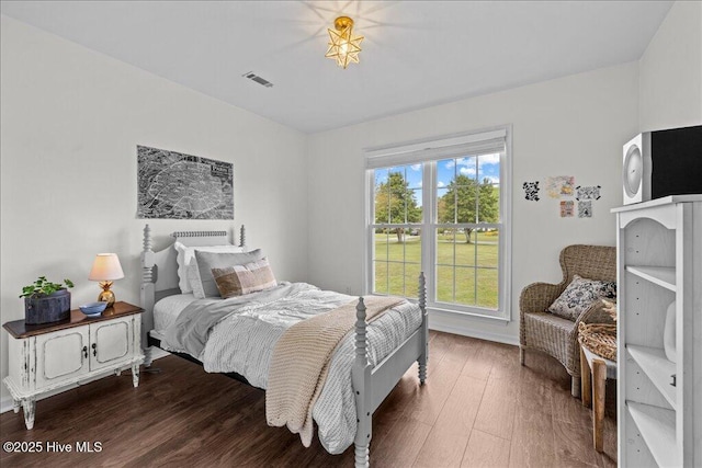bedroom with wood finished floors