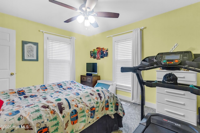 2446 Garys Ln, New Bern, NC 28562 - carpeted bedroom with a ceiling fan and multiple windows