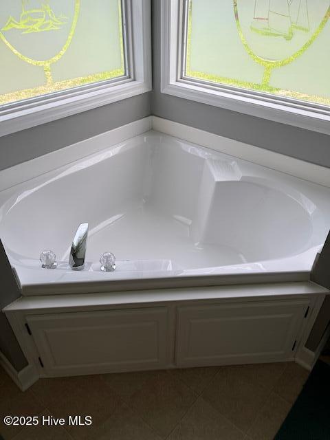 bathroom featuring a garden tub