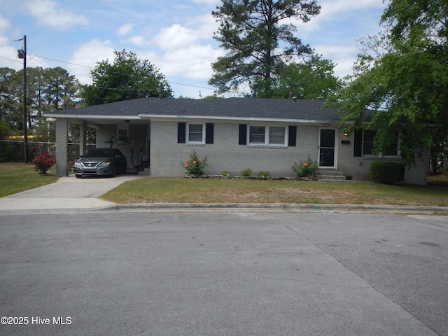 1714 Dillahunt St, New Bern, NC 28560 - ranch-style house with driveway, entry steps, brick siding, and a front yard