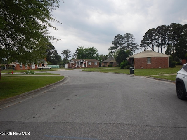 1714 Dillahunt St, New Bern, NC 28560 - view of asphalt street with curbs and a residential view