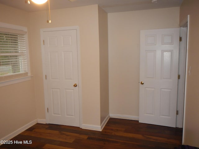 1714 Dillahunt St, New Bern, NC 28560 - unfurnished bedroom with dark wood-style flooring and baseboards