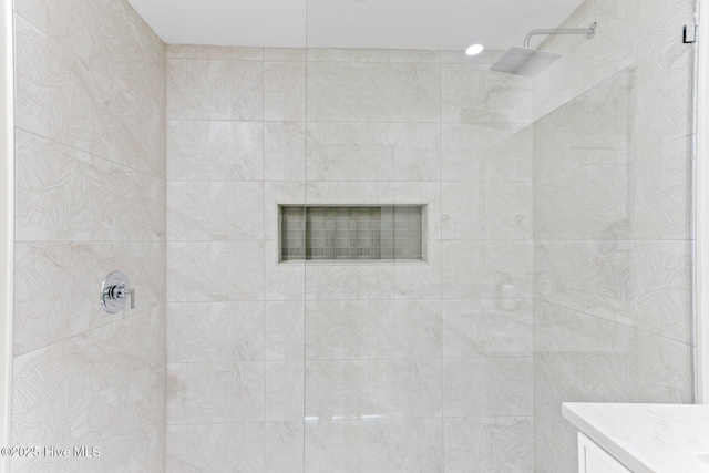 full bath with walk in shower and vanity