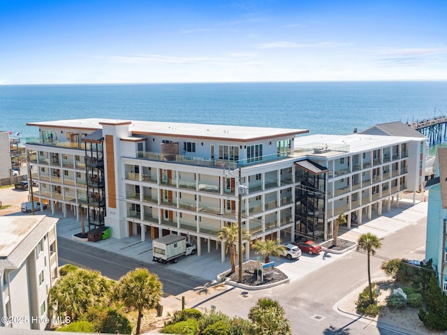view of apartment building / complex with a water view