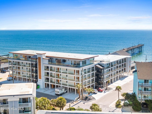 bird's eye view of apartment complex / building and a nearby body of water