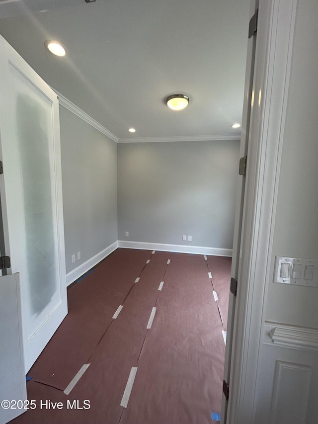 unfurnished room featuring ornamental molding, baseboards, and recessed lighting